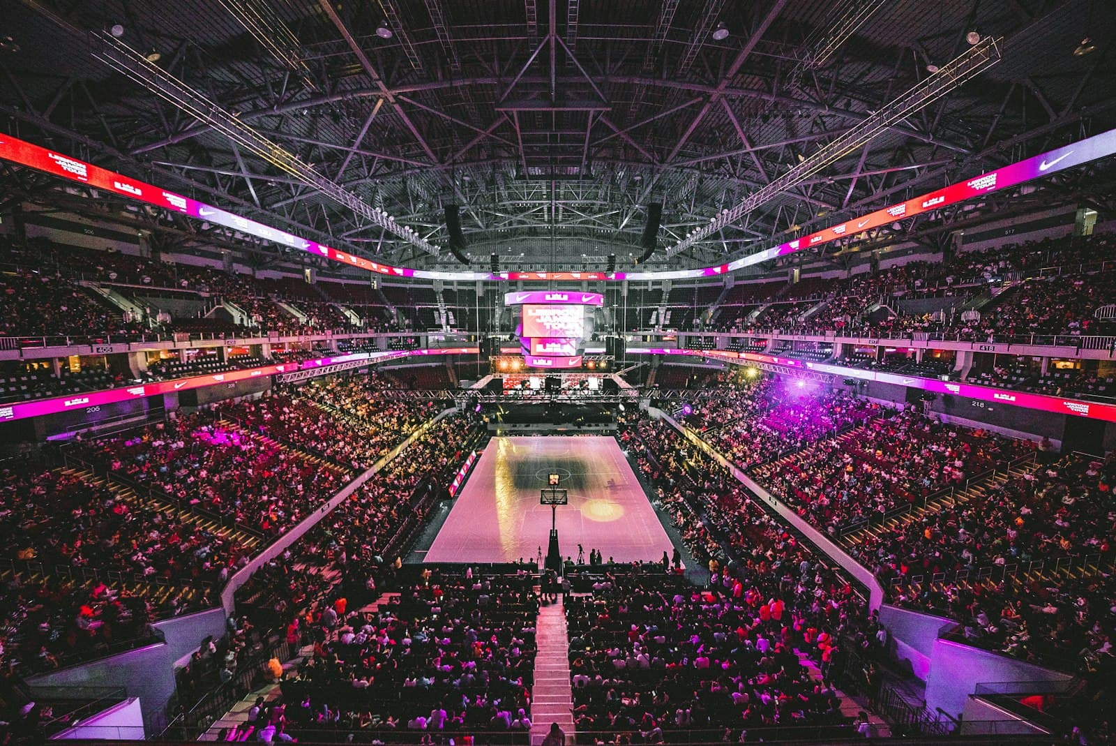 Packed indoor arena under bright lights